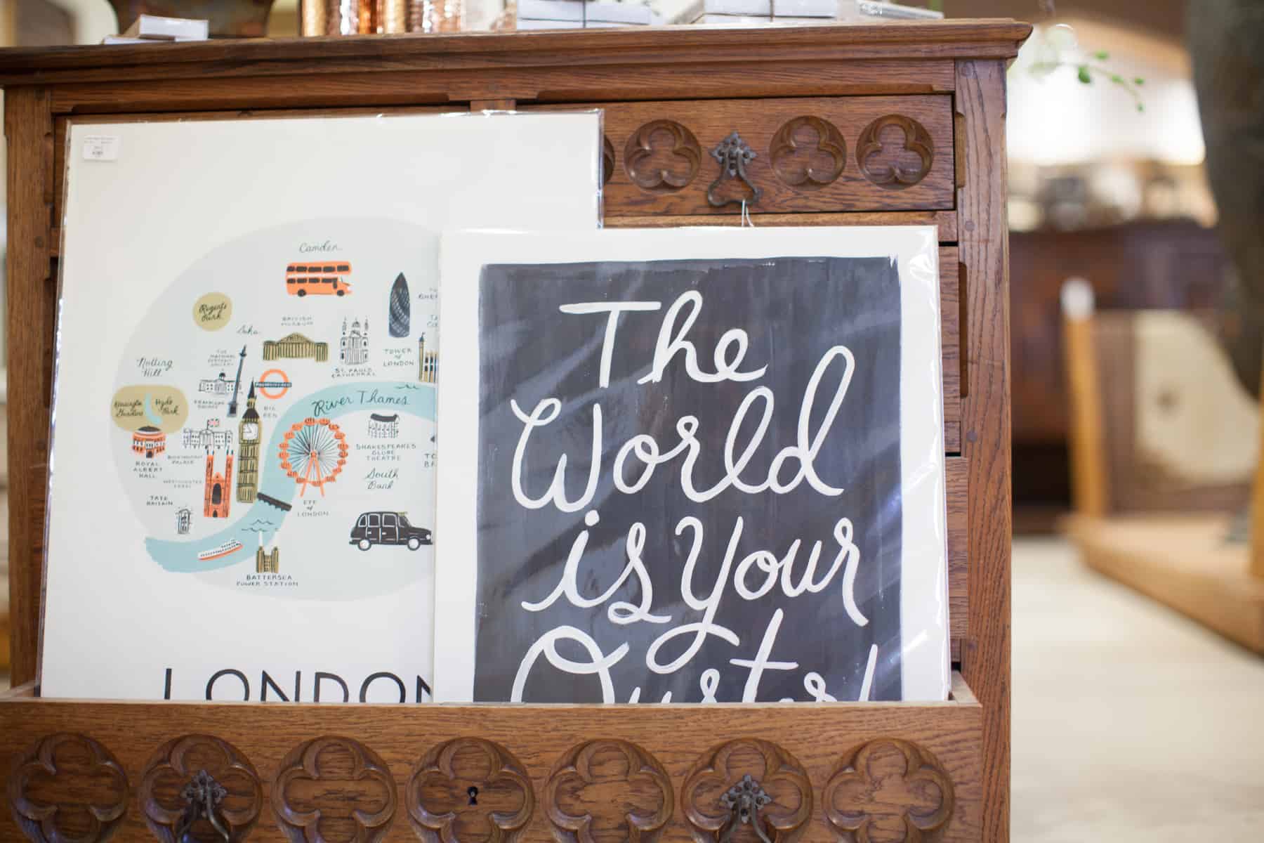 Home Furnishings: Antique dresser and modern prints.
